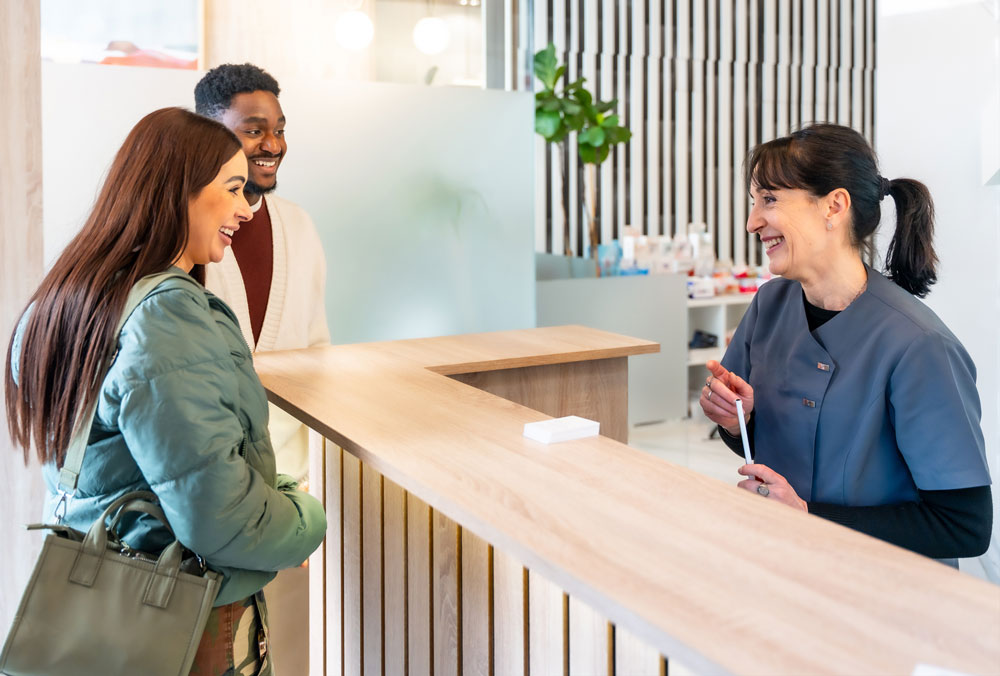 Patient talking to a receptionist